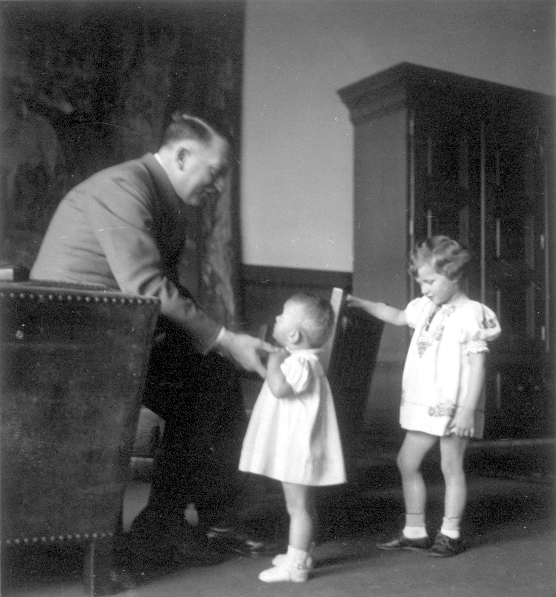Adolf Hitler with Uschi Schneider in the Berghof great hall, from Eva Braun's albums 